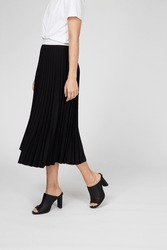 Black Women's Luxury Classic Long Maxi Pleated Skirt On Model Isolated On White Background. Woman Wearing Midi Folded Accordion Skirt, Summer Autumn Outfit. Side View. Template, Concept