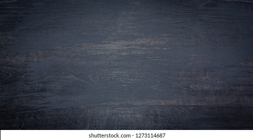 Black Wood Board Background. Wooden Grunge Texture. Painted Dark Wood Surface Table. Wide Angle Wallpaper Or Web Banner With Copy Space For Design