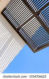 Black Wooden Boards Of A Pergola In A Pattern