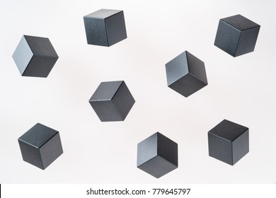 Black wooden cube shapes are floating. Concept of creative, logical thinking. Abstract geometric real floating wooden cube.