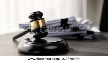 Black wooden gavel hammer and legal document in empty law firm or lawyer office background as justice and legal system for lawyer and judge, Legal authority and fairness in trials concept. equility