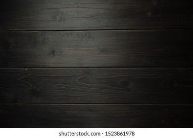 Black wooden textured background. Tesktura