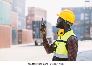 Black Worker African Working Engineer Foreman Radio Control In Port Cargo Shipping Customs Container Yard