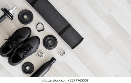 Black workout equipment for training at home or gym top view with copy space - Shutterstock ID 2297965509
