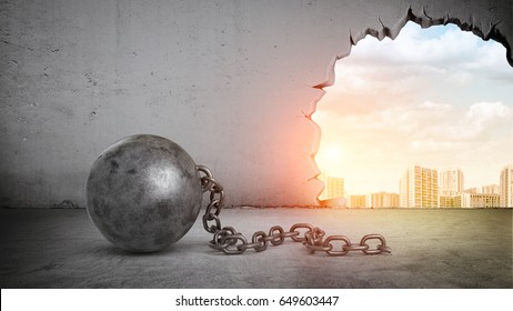 A black wrecking ball and hole in a concrete wall showing city landscape. Old building demolition. New construction site. Freshen up your life.