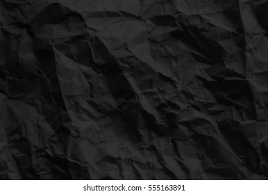black wrinkled paper texture.