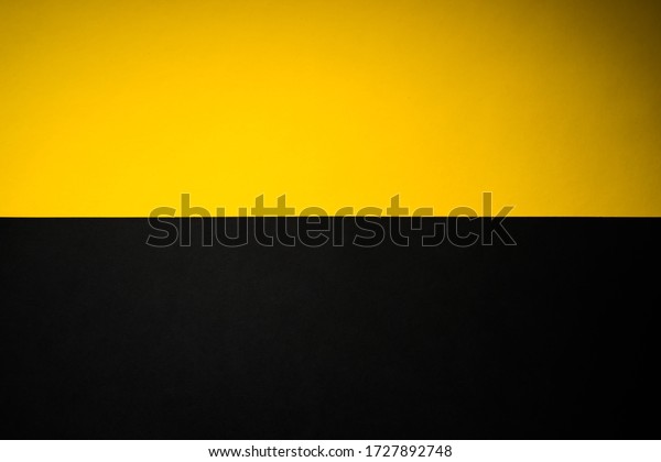 Black and yellow\
abstract divided\
background