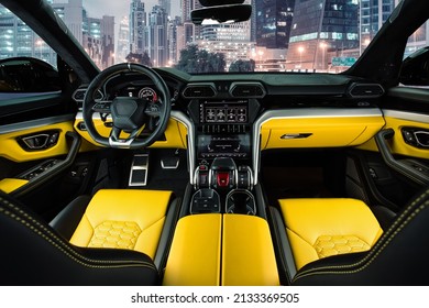 Black and yellow Italian super car suv leather interior high end automotive photography 