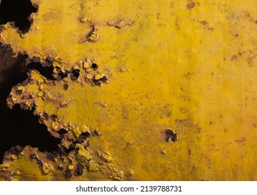 Black and yellow painted old grungy corroded weathered Metal sheet surface texture background. Space for text, title.