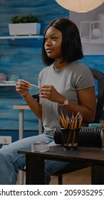 Black Young Artist Working On Vase Drawing At Home In Artwork Studio. African American Woman Using Art Tools, Pencil And White Canvas On Easel Creating Authentic Masterpiece As Hobby