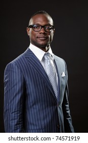 Black Young Business Man In Suit With Glasses Looking Serious.