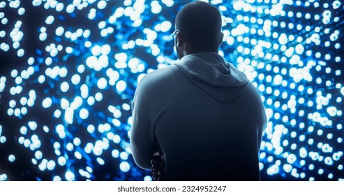 Black Young Man Looking at Big Screen with Neural Network Visualisation In 3D. Professional Computer Data Science Engineer Working in System Control and Monitoring Telecommunications Office