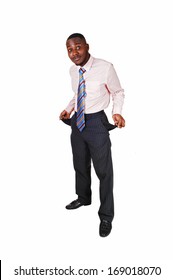 A Black Young Man Standing For White Background Turned His Pockets Out To Show He Has No Money. 