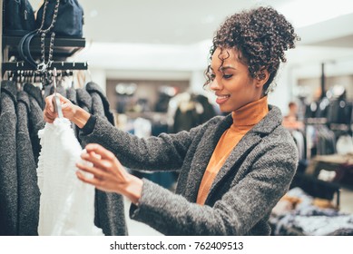 Black young woman doing shopping in a store