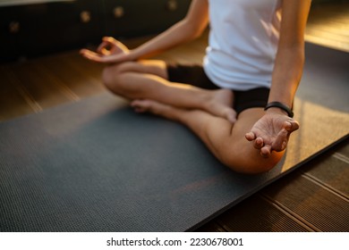 Black young woman meditation during yoga practice on rooftop outdoors - Powered by Shutterstock