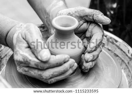 black-and-white clay pot in the process of creating a skilful potter with squabbled han