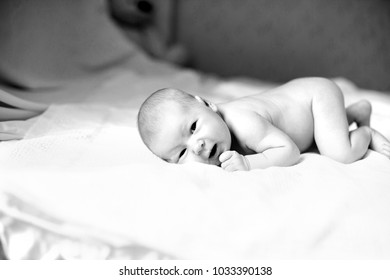 black-and-white photo in retro style.portrait of a newborn baby  - Shutterstock ID 1033390138