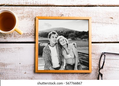 Black-and-white photo of seniors in picture frame. Studio shot. - Powered by Shutterstock