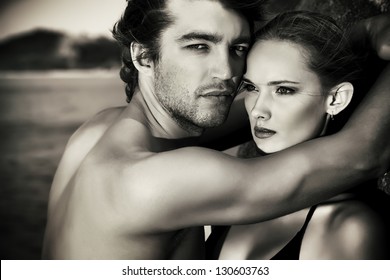 Black-and-white Portrait Of A Sexual Young Couple In Love Having Holidays On The Sea.