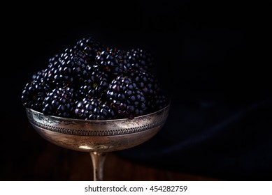 Blackberries In A Silver Old Cup In Dark Style Food Photography