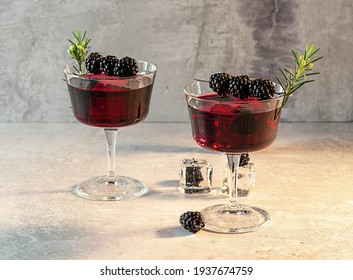 Blackberry Bramble With Fresh Muddled Blackberries, Gin, Lemon Juice, And Soda Water. Refreshing Summer Cocktail With Ice.