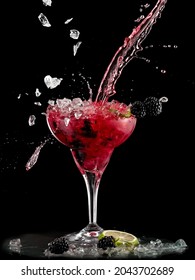 Blackberry Margarita Cocktail Splash On Black Background