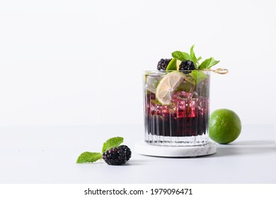 Blackberry Mojito Cocktail With Lime On Neutral Light Background. Summer Freshness Beverage For Festive Party. Holiday Mocktail With Copy Space.