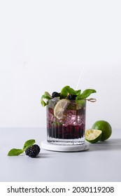 Blackberry Mojito Cocktail With Lime On Light Background. Summer Freshness Beverage For Festive Party. Holiday Mocktail.