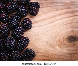 Blackberry On Wooden Background