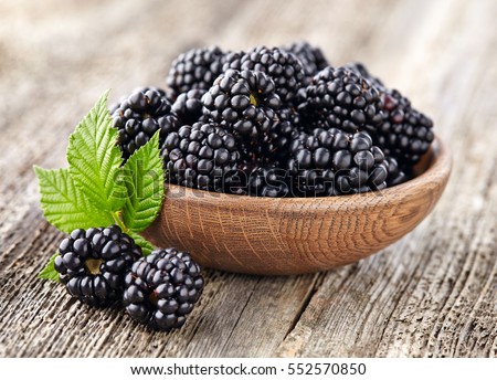 Blackberry on a wooden background