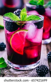 Blackberry Smash  Cocktail  With Lime,  Mint And Ice