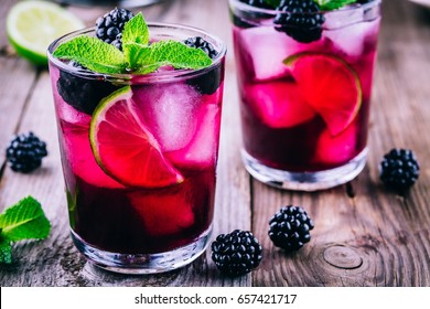 Blackberry Smash  Cocktail  With Lime,  Mint And Ice