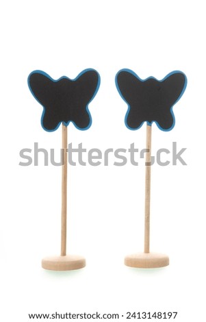 Blackboard in butterfly shape isolated over whitebackground