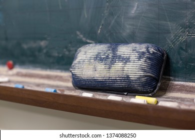 Blackboard With A Eraser And Chalk