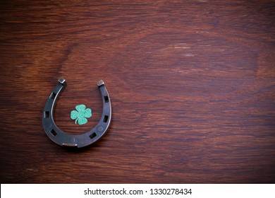 Blackboard With Four-leaved Clover And A Horse Shoe