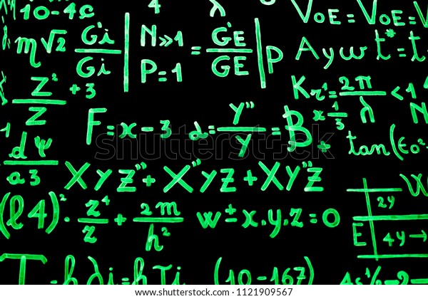 A blackboard\
full of mathematical equations written with phosphorescent paint to\
facilitate learning. Photograph taken inside the cinema museum in\
Turin, Italy.