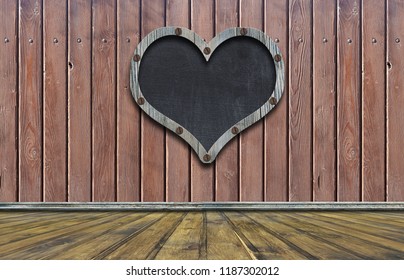 Blackboard Heart Shaped On Wood Wall / Empty Blackboard With Wooden Frame In The Shape Of A Heart. Hanging On A Wooden Wall With Planks