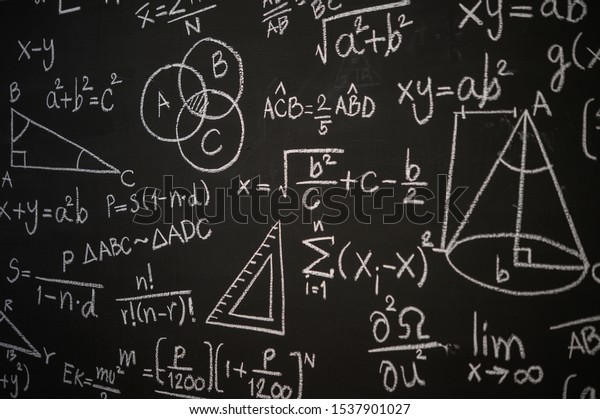 Blackboard inscribed with scientific formulas\
and calculations in physics, mathematics and electrical circuits.\
Science and education\
background.