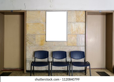 Blackboard On A Old Hospital Wall Surrounding By Doors A Chairs