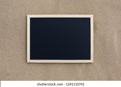 Blackboard on the sand