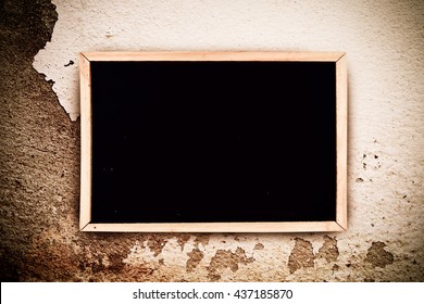 blackboard on white background on peeled color wall background