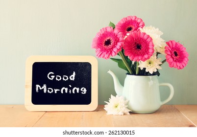 Blackboard With The Phrase Good Morning Written On It Next To Fresh Flowers