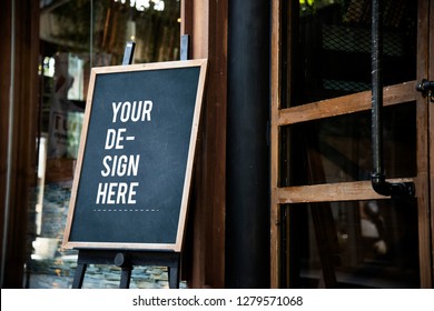 Blackboard sign mockup in front of a restaurant