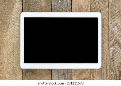 Blackboard in white frame on wooden background