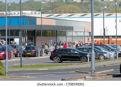 Blackburn , Lancashire/England - 17.04.2020 - Shoppers Queuing Outside Aldi Due To The Coronavirus Outbreak