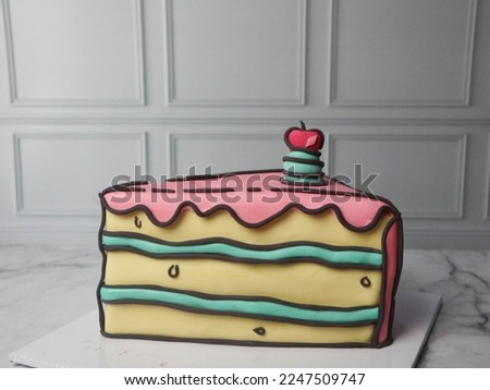 Blackforest cake decorated with comic or cartoon cake style. Birthday cake fondant. Selective focus. 