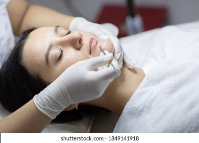 Blackhead Cleansing On Woman Face During Facial Treatment At Beauty Clinic. Professional Acne Extraction Procedure By Dermatologist. Healthcare And Beauty Concept