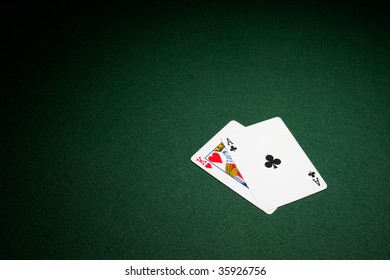 Blackjack Hand On Green Baize Table Ace And King