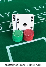 Blackjack Hand On A Blackjack Table Next To Stacks Of Poker Betting Chips