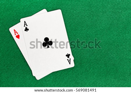 blackjack with two aces on green felt texture 